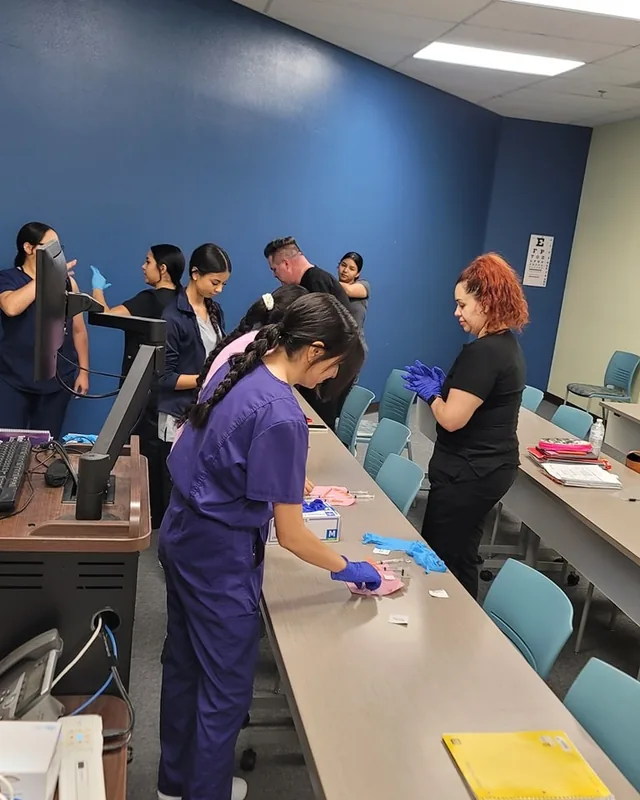 Students practicing clinical skills in the classroom